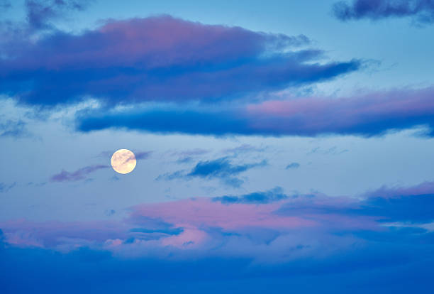 istock Full Moon and Pink Clouds at Dusk 2243718512