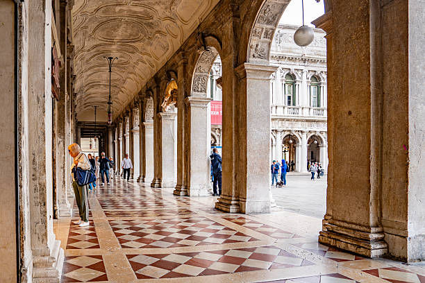 Tourists are walking on St Marks Square in the early morning,Venice,Italy