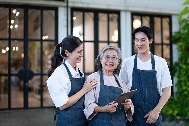 istock Mother, son and daughter are working at their DIY store. 2243722665