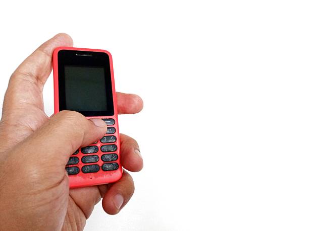 istock Jakarta, Indonesia, hand pose holding an old cellphone 2243722726