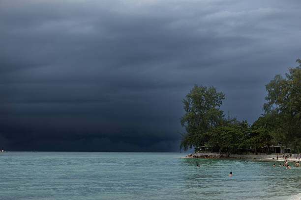 Darwin, Northern Territory, Australia-November 3,2017: Gloomy, grey, storm clouds over the Timor Sea harbour with military ship and marina in Darwin, Australia