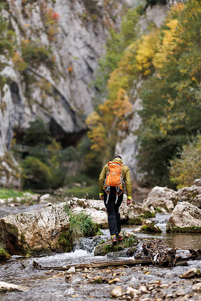istock Male hiker exploring wonderful autumn landscape 2243726933