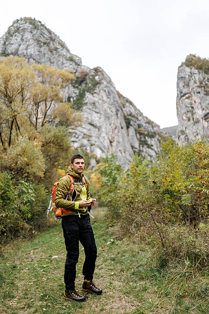 istock Male hiker exploring wonderful autumn landscape 2243726959