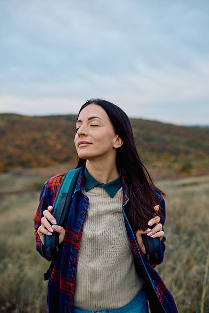 istock Woman enjoying fresh air while hiking in nature 2243728911