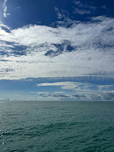 istock Glittering sea and sky with beautiful clouds. 2243731547