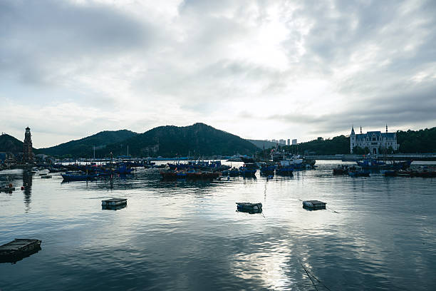 Urban skyline of the port dock under the Gangkou Bridge in Gangkou Town, Shuangyue Bay, Huidong County, Huizhou, Guangdong Province, China, shot in January