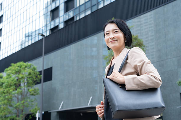 istock a middle-aged businesswoman working in an office district 2243733285