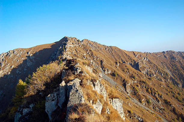 istock A scenic mountain ridge with rocky terrain under clear blue sky 2243733302