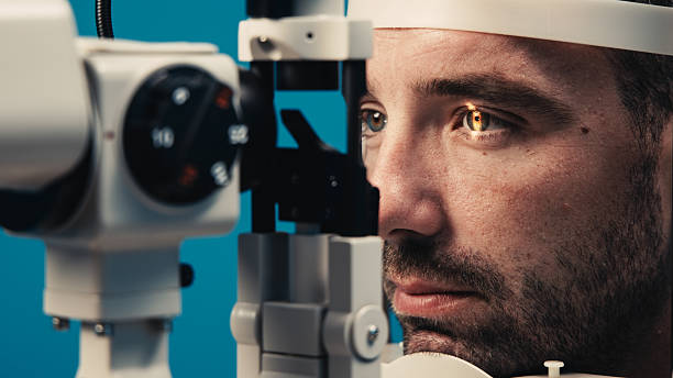 istock Male patient undergoing detailed vision examination with advanced ophthalmic equipment 2243734725