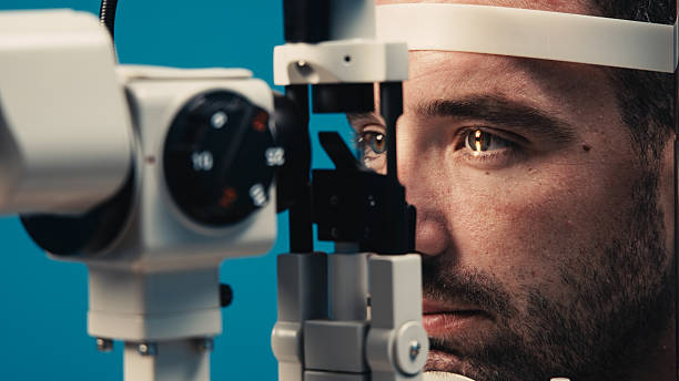 istock Male patient undergoing detailed vision examination with advanced ophthalmic equipment 2243734729