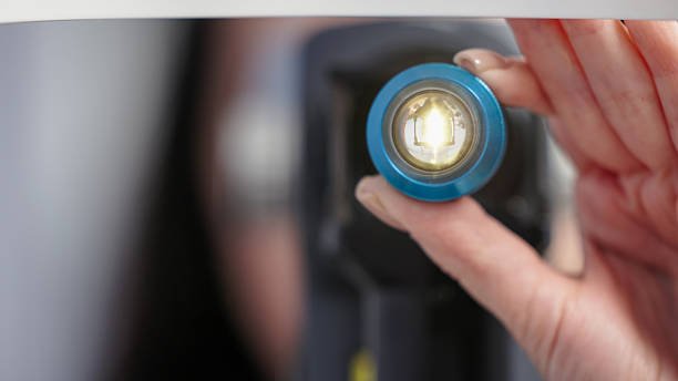 Ophthalmic examination device with bright light illuminating lens, showcasing advanced technology for vision assessment and eye health evaluation in clinical setting