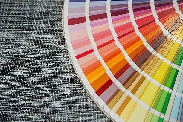 istock Color palette samples on woven black background for design and printing industry concepts 2243735516