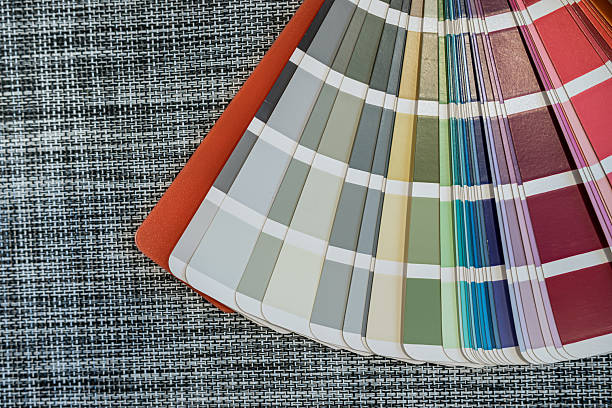 istock Color palette samples on woven black background for design and printing industry concepts 2243735732