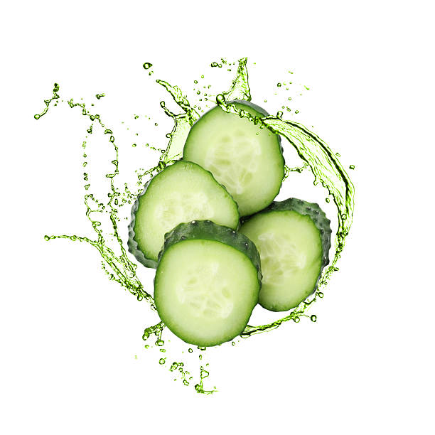 istock Cucumber slices and splash against white background 2243735880