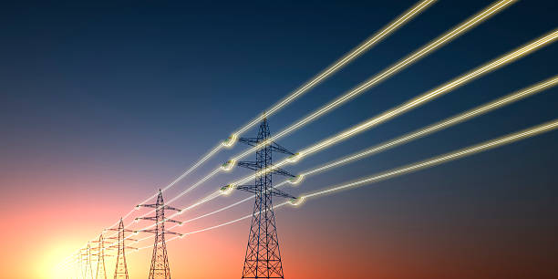 istock Electricity transmission towers with glowing wires 2243735910