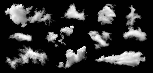 istock Collection of white fluffy cloud shapes isolated on black background, realistic sky elements for digital design, weather illustration, overlay texture, or creative atmospheric concept background. 2243736231