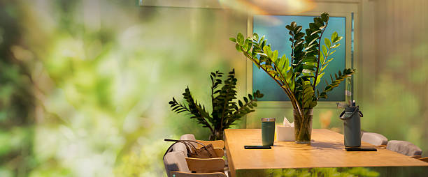 Modern eco friendly home interior with wooden table, indoor plants, and natural light reflecting sustainable lifestyle, minimal design, and calm atmosphere for relaxation and green living inspiration.