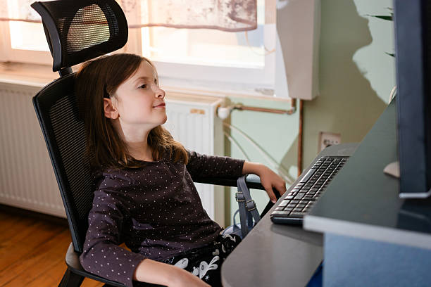 istock Young girl learning online from home with computer 2243737760