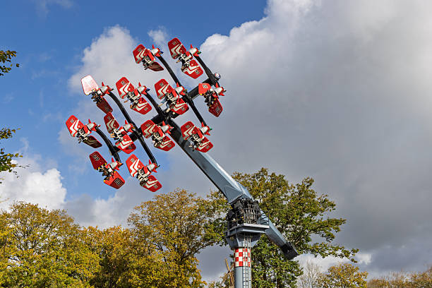 Villach, Austria - July 30, 2025: Exciting amusement ride at Villacher Kirchtag festival, featuring bright colors and thrilling atmosphere under a clear blue sky