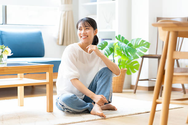 istock young woman relaxing at home 2243738593