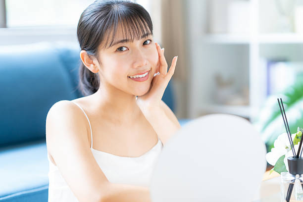 istock young woman doing skin care 2243738696