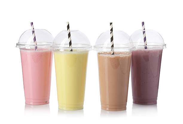 istock Milkshakes of different flavors in plastic cups isolated on white 2243741852