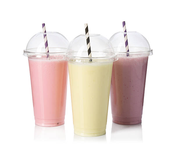 istock Milkshakes of different flavors in plastic cups isolated on white 2243741875