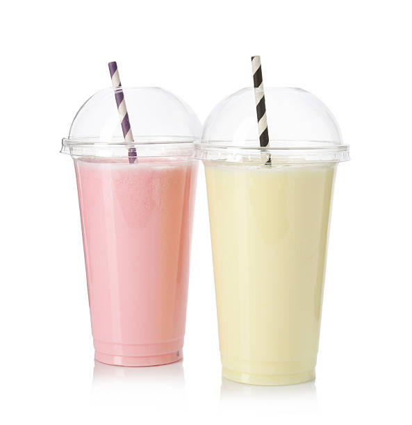 istock Milkshakes of different flavors in plastic cups isolated on white 2243741883