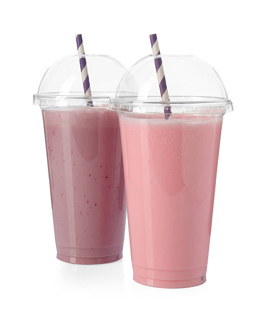 istock Milkshakes of different flavors in plastic cups isolated on white 2243741910