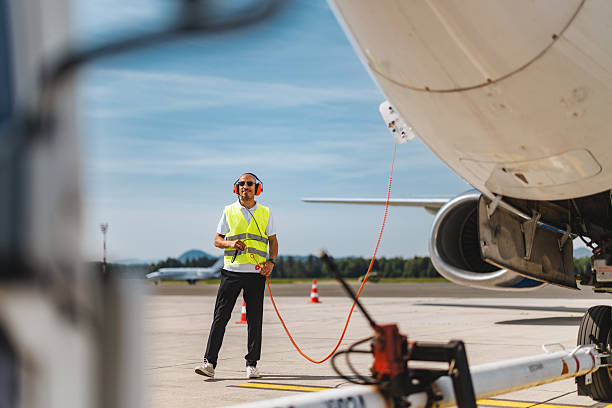 istock Content Mid Adult Hispanic Technician Engaging in Aircraft Maintenance on Clear Day 2243744151