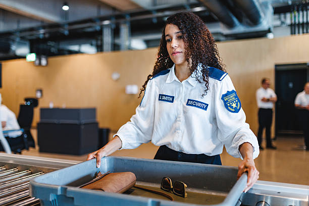 istock Focused Young Hispanic Female Airport Security Worker Handling Baggage Screening Indoors 2243744267