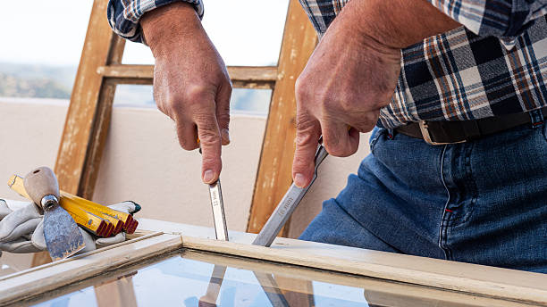 istock Carpenter at work, restoring an old wooden window. Carpentry. 2243745135
