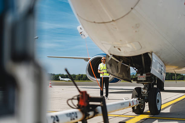 istock Confident Hispanic Professional Conducting Thorough Systems Inspection on Cargo Plane 2243745282