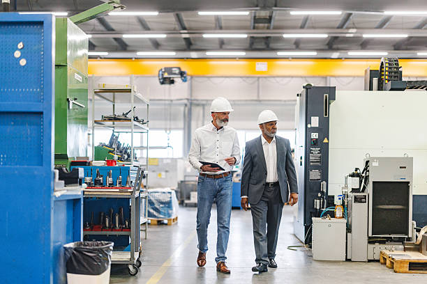 istock Engaged Engineers Discussing Production Strategies in Modern Industrial Workshop 2243745400