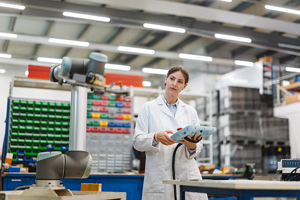 istock Mid Adult Caucasian Female Engineer Evaluating Robotic Arm in Industrial Laboratory Setting 2243745445