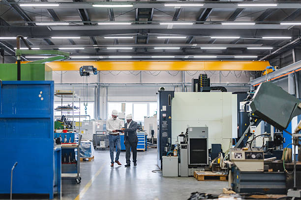 istock Industrial Professionals Collaborating on Factory Workflow with Digital Technology 2243745535