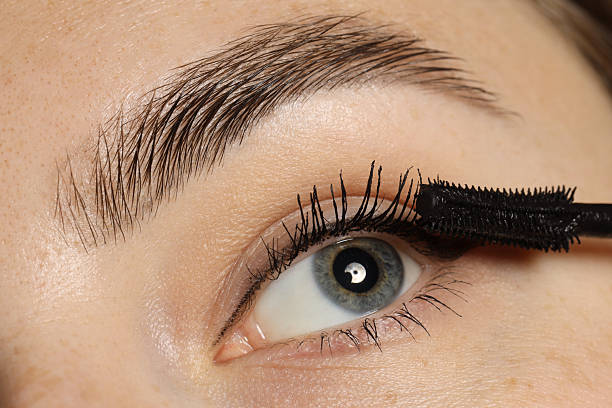 istock Woman applying mascara onto her eyelashes, closeup 2243746064