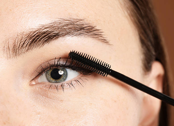 istock Woman applying mascara onto her eyelashes, closeup 2243746212