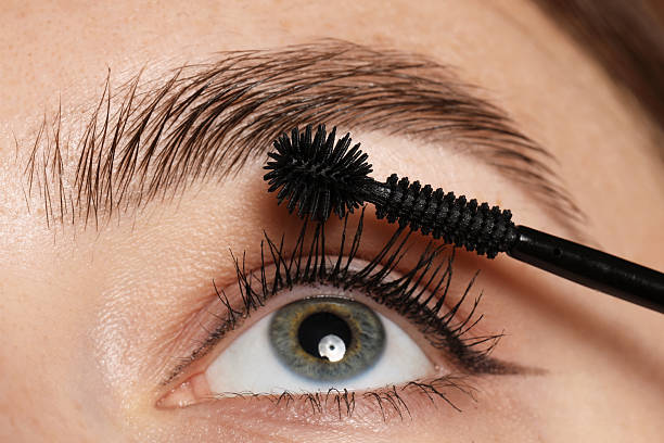 istock Woman applying mascara onto her eyelashes, closeup 2243746257