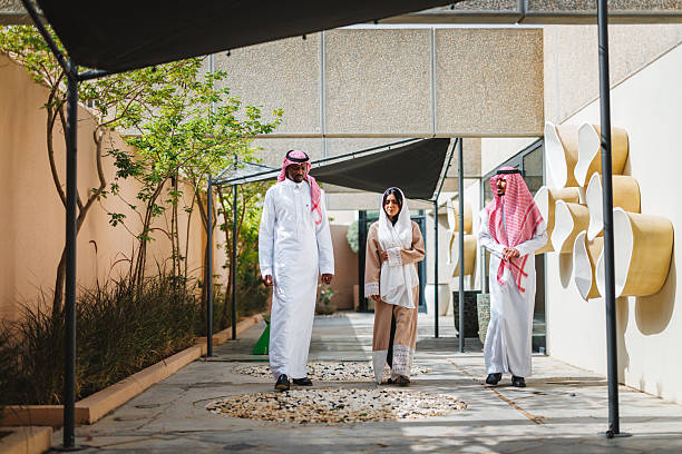 istock Middle Eastern Adults Walking Together in Courtyard Wearing Traditional Attire 2243747698