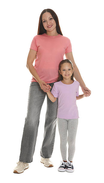 istock Mother and daughter posing together on white background 2243747721