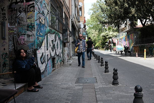 A street in the lively district of Kadikoy , Istanbul . Kadikoy is a place loved by the youth with a cool vibe and vibrant atmosphere .Lot's of venues with live music , coffee shops, stores, markets, Meyhanes and restaurants , mostly well priced for a rather young clientele .