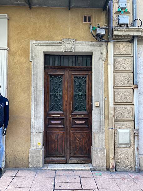 istock Wooden Door with Windows and Stone Frame 2243758348