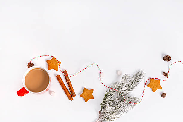 istock Festive Christmas background for your text on a white insulated background, mug with cocoa, cones and Christmas balls. 2243758518