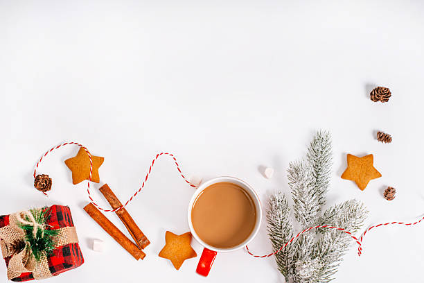 istock Festive Christmas background for your text on a white insulated background, mug with cocoa, cones and Christmas balls. 2243758532