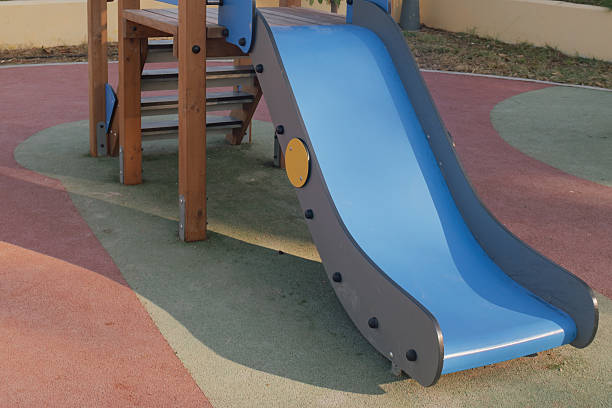 istock Playground fun: colorful plastic slide ready for children's outdoor activity 2243759600