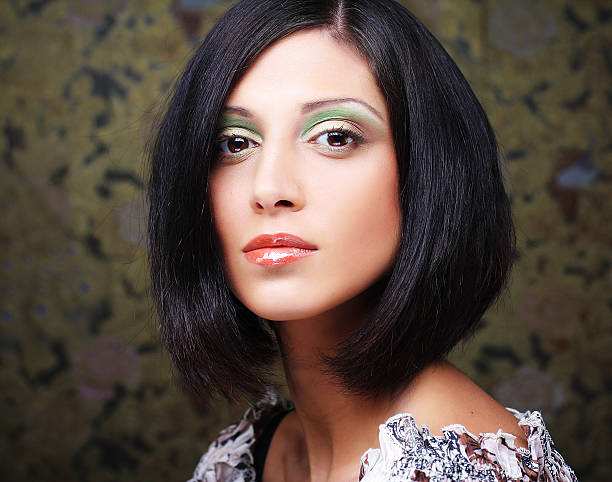 istock young brunette woman close-up portrait, bright make up 2243760855