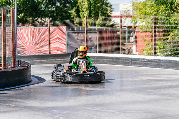 istock Boy driving go-kart on a track during a race 2243761107