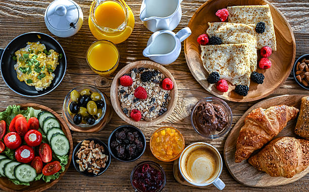 istock Breakfast served with coffee, eggs, cereals and croissants 2243763268