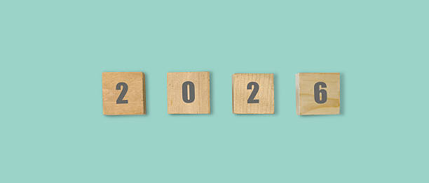 istock Wooden cubes showing number 2026 on pastel background 2243763301